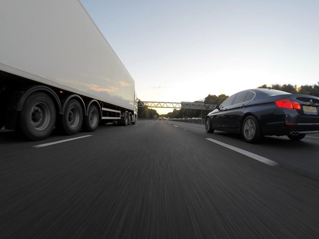 Truck-and-car-on-highway-1024x768