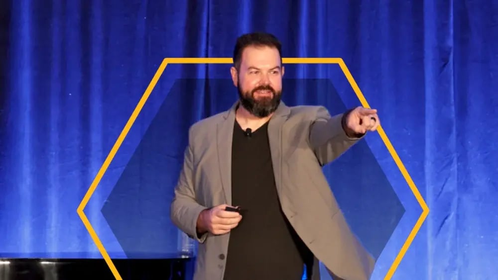 Josh Turley speaking on stage at a fleet industry conference